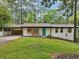 Charming home with a well-kept lawn, driveway, a pop of color on the front door at 3356 Thornewood Dr, Atlanta, GA 30340