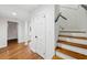 Hallway with wooden stairs, door, and hardwood floors at 3356 Thornewood Dr, Atlanta, GA 30340