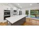 Bright, open kitchen with stainless steel appliances, white cabinets, and a large island for entertaining at 3356 Thornewood Dr, Atlanta, GA 30340
