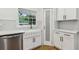 Close-up of kitchen with stainless steel appliances, white cabinets, and subway tile backsplash at 3356 Thornewood Dr, Atlanta, GA 30340