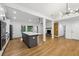 Spacious open-concept kitchen with white cabinets, stainless steel appliances, and center island at 3356 Thornewood Dr, Atlanta, GA 30340