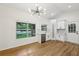 Bright kitchen features white cabinets, stainless steel appliances, and a large window view at 3356 Thornewood Dr, Atlanta, GA 30340