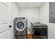 Laundry room featuring a new washer and dryer and white walls and trim at 3356 Thornewood Dr, Atlanta, GA 30340