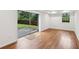 Living room with hardwood floors, recessed lighting, and sliding glass door to backyard at 3356 Thornewood Dr, Atlanta, GA 30340