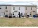 Backyard featuring a concrete patio and grass at 6179 Centennial Run, Atlanta, GA 30349