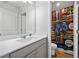 Bathroom featuring a light grey vanity and a gaming-themed shower curtain at 6179 Centennial Run, Atlanta, GA 30349