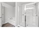 Bright bathroom featuring a glass enclosed shower with a tub nearby at 6179 Centennial Run, Atlanta, GA 30349