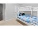 Neutral bedroom featuring a bunk bed and a dark grey door at 6179 Centennial Run, Atlanta, GA 30349