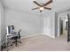 Bedroom featuring a light fixture, desk, and a computer monitor at 6179 Centennial Run, Atlanta, GA 30349