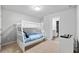 Neutrally decorated bedroom featuring a bunk bed with a colorful gaming-themed painting at 6179 Centennial Run, Atlanta, GA 30349