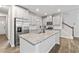 Bright kitchen featuring white cabinets, granite countertops, and stainless steel appliances at 6179 Centennial Run, Atlanta, GA 30349