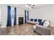 Inviting living room with a fireplace, hardwood flooring, and comfortable neutral colored seating at 6179 Centennial Run, Atlanta, GA 30349