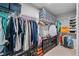 Organized walk-in closet with shelves, hanging racks, and storage boxes for ample storage at 6179 Centennial Run, Atlanta, GA 30349