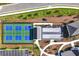 An aerial view of community amenities, including pickleball courts, bocce ball courts and beautifully landscaped walking trails at 7 Hickory Branch, Hiram, GA 30141