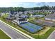 Aerial view of the neighborhood pickle ball courts, lake and clubhouse at 7 Hickory Branch, Hiram, GA 30141