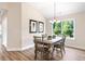 Cozy dining area with natural light, stylish lighting fixture, and charming decor at 7 Hickory Branch, Hiram, GA 30141