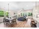 Open concept living room with a large window, dining area and modern furnishings at 7 Hickory Branch, Hiram, GA 30141