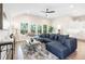 Open-concept living room with lots of natural light and a comfortable sectional sofa at 7 Hickory Branch, Hiram, GA 30141