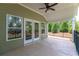 Covered patio with ceiling fan and view of backyard and trees at 7 Hickory Branch, Hiram, GA 30141