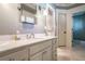 Bathroom featuring marble countertops, custom cabinetry and tile floors at 1691 Doncaster Ne Dr, Atlanta, GA 30309