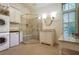 Bright, clean bathroom features a glass walk-in shower, tile floors, and a vanity sink at 1691 Doncaster Ne Dr, Atlanta, GA 30309