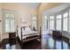 Bright and airy bedroom boasts hardwood floors and large windows with plantation shutters at 1691 Doncaster Ne Dr, Atlanta, GA 30309