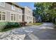 A long driveway leads up to this beautiful home with lush landscaping and plenty of parking space at 1691 Doncaster Ne Dr, Atlanta, GA 30309