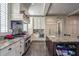 Spacious kitchen features custom cabinets, granite counters, an island, and stainless steel appliances at 1691 Doncaster Ne Dr, Atlanta, GA 30309