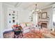 Inviting living room with built-in shelves, a fireplace, and a decorative chandelier at 1691 Doncaster Ne Dr, Atlanta, GA 30309