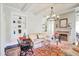 Cozy living room with fireplace, built-in bookshelves, and abundant natural light at 1691 Doncaster Ne Dr, Atlanta, GA 30309