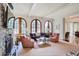 Bright living room features a stone fireplace, built-in cabinets, and large windows at 1691 Doncaster Ne Dr, Atlanta, GA 30309