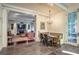 Connected dining and living spaces featuring elegant flooring and an open floor plan at 1691 Doncaster Ne Dr, Atlanta, GA 30309