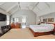 Spacious main bedroom featuring a coffered ceiling, ceiling fan, and ensuite access at 1691 Doncaster Ne Dr, Atlanta, GA 30309