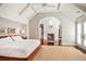 Bright main bedroom featuring a fireplace, ensuite, and access to a walk-in closet at 1691 Doncaster Ne Dr, Atlanta, GA 30309