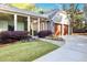 Elegant covered walkway connects the home to the garage, surrounded by beautiful landscaping at 1691 Doncaster Ne Dr, Atlanta, GA 30309