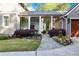 Elegant covered walkway connects the home to the garage, surrounded by beautiful landscaping at 1691 Doncaster Ne Dr, Atlanta, GA 30309