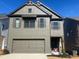 Beautiful two-story home with a two-car garage and classic architectural details at 4574 Eastbrook Pl, Snellville, GA 30039