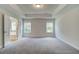 Spacious Primary bedroom with two windows and an entrance into the Primary bathroom at 4574 Eastbrook Pl, Snellville, GA 30039
