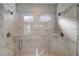 New bathroom with marble-like shower and glass doors at 4574 Eastbrook Pl, Snellville, GA 30039