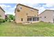 View of a two-story home with a screened-in porch and a spacious backyard at 80 Lanier Rdg, Acworth, GA 30101
