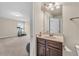 Bathroom with wood vanity, great lighting and a peek into workout room at 80 Lanier Rdg, Acworth, GA 30101