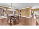 Dining room featuring hardwood floors, a dining table, and an open transition to other rooms at 80 Lanier Rdg, Acworth, GA 30101