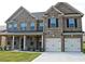 Beautiful brick two story home with a two car garage and a well manicured lawn at 80 Lanier Rdg, Acworth, GA 30101