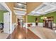Bright foyer features wood floors, green walls, chandelier, and white trim work at 80 Lanier Rdg, Acworth, GA 30101