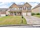 Beautiful brick home with a well-manicured lawn and two-car garage at 80 Lanier Rdg, Acworth, GA 30101
