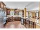 Kitchen featuring granite countertops, stainless steel appliances, and dark wood cabinetry at 80 Lanier Rdg, Acworth, GA 30101