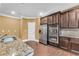 Spacious kitchen with stainless steel appliances, granite countertops, and dark wood cabinets at 80 Lanier Rdg, Acworth, GA 30101