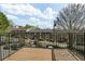 Cozy balcony features an ornamental black railing and a beautiful view of the neighborhood at 869 Briarcliff Ne Rd # B11, Atlanta, GA 30306