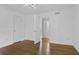 Bright bedroom features hardwood floors, two closets, neutral walls, and ceiling fan at 869 Briarcliff Ne Rd # B11, Atlanta, GA 30306