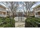 View of the townhouse community with well-maintained landscaping, and gated access to common areas at 869 Briarcliff Ne Rd # B11, Atlanta, GA 30306